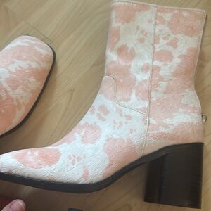 Intentionally Blank Cow print boots in pink.